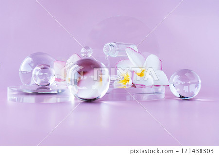 A calming setup features crystal spheres and vibrant flowers, perfect for spa ambiance and skincare. A calming setup features crystal spheres and vibrant flowers, perfect for spa ambiance and skincare. 121438303