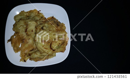 Vegetable bakwan. Fried vegetables are a snack in the form of flour dough mixed with carrots, leek and cabbage pieces. Bakwan vegetable or fried vegetables is one of the typical Indonesian foods. Vegetable bakwan. Fried vegetables are a snack in the form of flour dough mixed with carrots, leek and cabbage pieces. Bakwan vegetable or fried vegetables is one of the typical Indonesian foods. 121438561