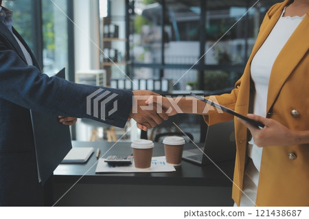 Business handshake for teamwork of business merger and acquisition,successful negotiate,hand shake,two businessman shake hand with partner to celebration partnership and business deal concept 121438687