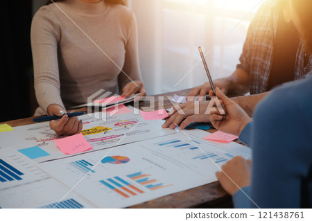 Team of business people working together in the meeting room office, teamwork background charts and graphs banner, double exposure successful teamwork,business planning concept. 121438761