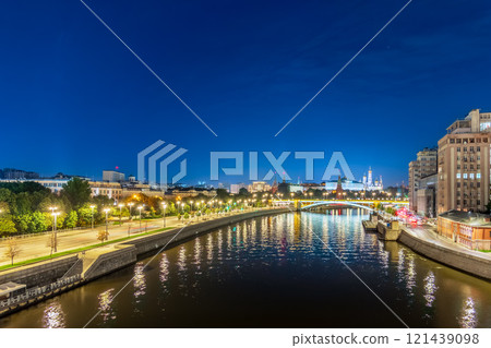 Illuminated Moscow Kremlin and Bolshoy Kamenny Bridge at summer night. View from the Patriarshy pedestrian Bridge Illuminated Moscow Kremlin and Bolshoy Kamenny Bridge at summer night. View from the Patriarshy pedestrian Bridge 121439098