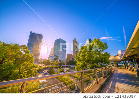 Yokohama cityscape in Japan: Yokohama City Hall and buildings bathed in the morning sun, and Sakuragicho Station in front of the station in the early morning. A ray of hope for tomorrow... = 3rd 121439397