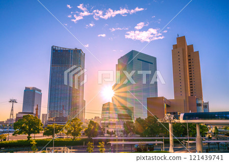 Yokohama cityscape in Japan: Yokohama City Hall and buildings bathed in the morning sun, and Sakuragicho Station in front of the station in the early morning. A ray of hope for tomorrow... = 3rd Yokohama cityscape in Japan: Yokohama City Hall and buildings bathed in the morning sun, and Sakuragicho Station in front of the station in the early morning. A ray of hope for tomorrow... = 3rd 121439741