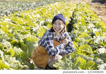 Farmer woman working in the field 121440689