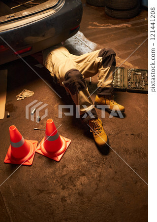 Mechanic Repairing Engine Of The Car 121441208