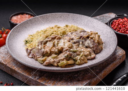 Bowl of food with beef, bulgur, tomatoes, zucchini and sauce Bowl of food with beef, bulgur, tomatoes, zucchini and sauce 121441610