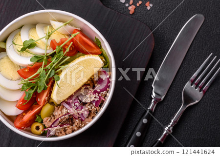 Salad with tuna pieces, boiled egg, cherry tomatoes, lettuce Salad with tuna pieces, boiled egg, cherry tomatoes, lettuce 121441624