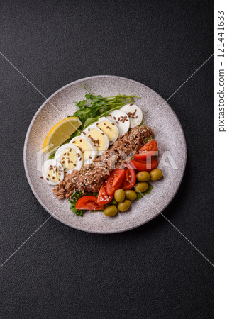 Salad with tuna pieces, boiled egg, cherry tomatoes, lettuce 121441633