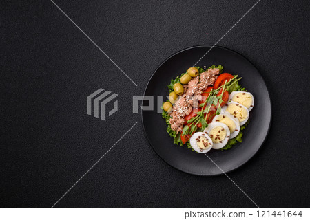 Salad with tuna pieces, boiled egg, cherry tomatoes, lettuce 121441644