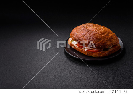 Ciabata with jamon or prosciutto, tomatoes, cheese and lettuce 121441731