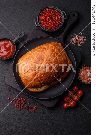 Ciabata with jamon or prosciutto, tomatoes, cheese and lettuce Ciabata with jamon or prosciutto, tomatoes, cheese and lettuce 121441742