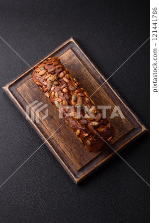 Brown bread with seeds, grains, salt and spices 121441786