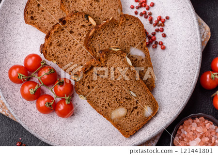 Brown bread with seeds, grains, salt and spices Brown bread with seeds, grains, salt and spices 121441801