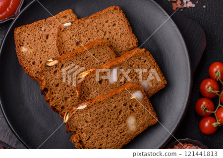 Brown bread with seeds, grains, salt and spices Brown bread with seeds, grains, salt and spices 121441813