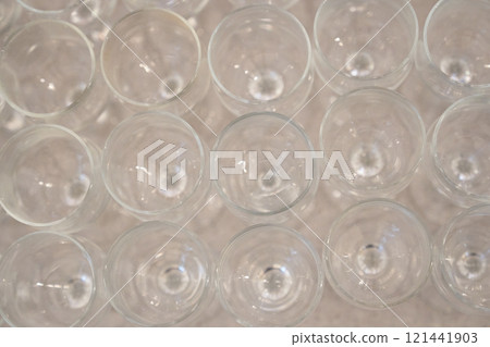 Lots of empty wine glasses on the table. Meals at the restaurant for the reception and alcoholic party. High quality photo 121441903
