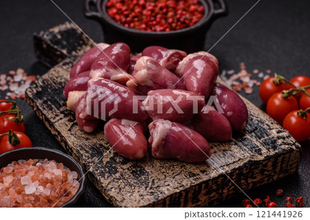 Raw chicken hearts with salt, spices and herbs Raw chicken hearts with salt, spices and herbs 121441926