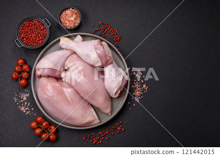Pieces of raw chicken or turkey fillet with salt, spices and herbs 121442015
