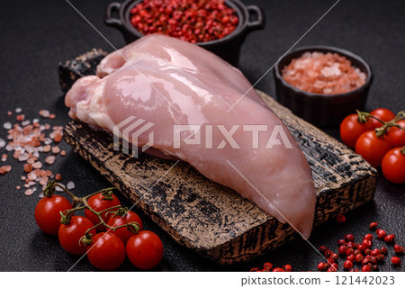 Pieces of raw chicken or turkey fillet with salt, spices and herbs 121442023