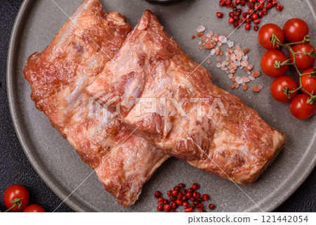 Pork ribs in sweet and sour sauce with salt and spices 121442054