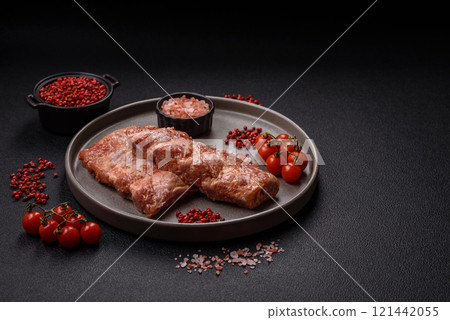 Pork ribs in sweet and sour sauce with salt and spices 121442055