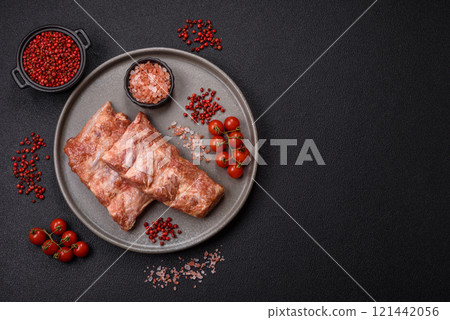 Pork ribs in sweet and sour sauce with salt and spices 121442056