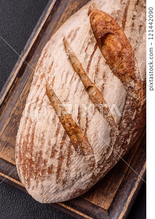 Brown bread with seeds, grains, salt and spices Brown bread with seeds, grains, salt and spices 121442090