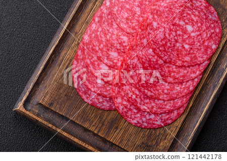 Delicious smoked salami sausage with salt, spices and herbs 121442178