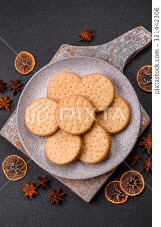 Round dotted snack snack cookies with cream Round dotted snack snack cookies with cream 121442306