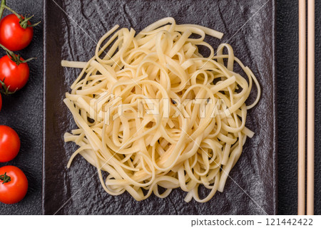 Rice noodles with beans, meat, tomato sauce, spices and herbs Rice noodles with beans, meat, tomato sauce, spices and herbs 121442422
