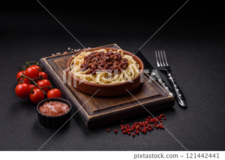 Rice noodles with beans, meat, tomato sauce, spices and herbs 121442441