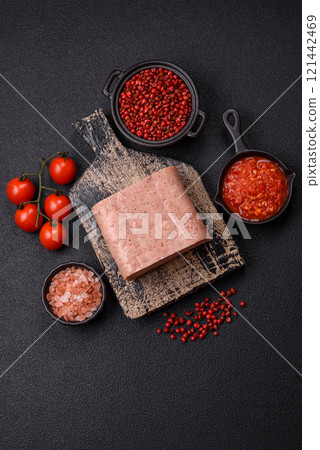 Delicious canned pink spiced ham or spam with salt, spices and herbs Delicious canned pink spiced ham or spam with salt, spices and herbs 121442469