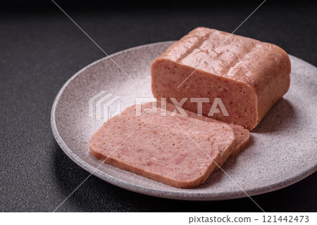 Delicious canned pink spiced ham or spam with salt, spices and herbs 121442473
