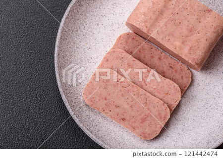 Delicious canned pink spiced ham or spam with salt, spices and herbs 121442474