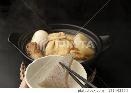 Pick up the oden with chopsticks Pick up the oden with chopsticks 121443224