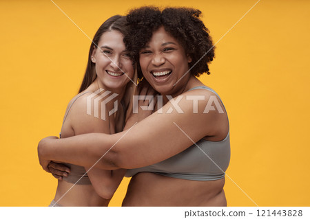 Happy Girls Embracing Each Other Happy Girls Embracing Each Other 121443828
