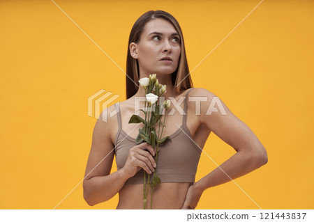 Pretty Girl Posing With Flowers 121443837
