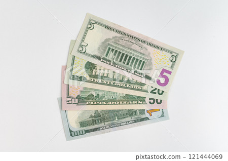 5, 20, 50, 100 dollars banknotes at different angles. Close up of dollars on white background. 5, 20, 50, 100 dollars banknotes at different angles. Close up of dollars on white background. 121444069
