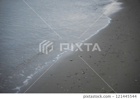 Sandy beach and waves before nightfall 121445544