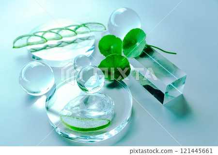 Delicate glass elements and aloe leaves create a serene spa environment filled with tranquility. Delicate glass elements and aloe leaves create a serene spa environment filled with tranquility. 121445661