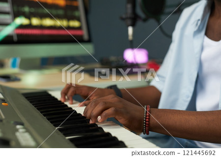 Musician Playing Piano In Studio 121445692