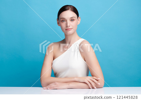 Beautiful young woman with clean fresh skin on blue background, Face care, Facial treatment, Cosmetology, beauty and spa, women portrait. 121445828