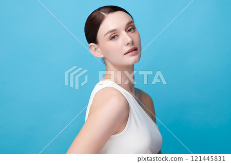 Beautiful young woman with clean fresh skin on blue background, Face care, Facial treatment, Cosmetology, beauty and spa, women portrait. 121445831