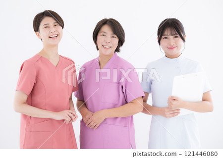 Image of three nurses lined up looking at the camera, white background Image of three nurses lined up looking at the camera, white background 121446080