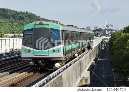 A Red Line train running on the elevated track of the Kaohsiung Rapid Transit System in Taiwan passes by the World Games metro station. A Red Line train running on the elevated track of the Kaohsiung Rapid Transit System in Taiwan passes by the World Games metro station. 121446724