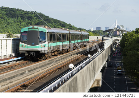 A Red Line train running on the elevated track of the Kaohsiung Rapid Transit System in Taiwan passes by the World Games metro station. A Red Line train running on the elevated track of the Kaohsiung Rapid Transit System in Taiwan passes by the World Games metro station. 121446725