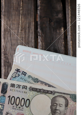 New banknotes and regular savings passbook - household finances image New banknotes and regular savings passbook - household finances image 121446926