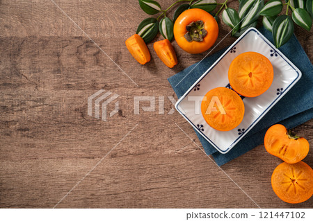 persimmon persimmon sweet fruit fresh ripe top view ripe sweet persimmon あまかき sweet persimmon 121447102