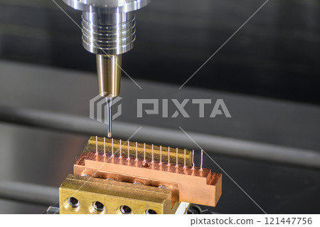 The CNC milling machine cutting the copper electrode parts by solid ball nose end mill tools. 121447756
