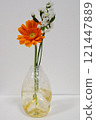 Gerbera in a glass bottle 121447889