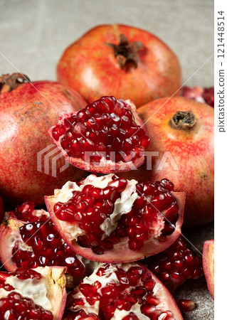 Ripe pomegranates, peeled and whole, the concept of benefits and vitamins in fruit. 121448514